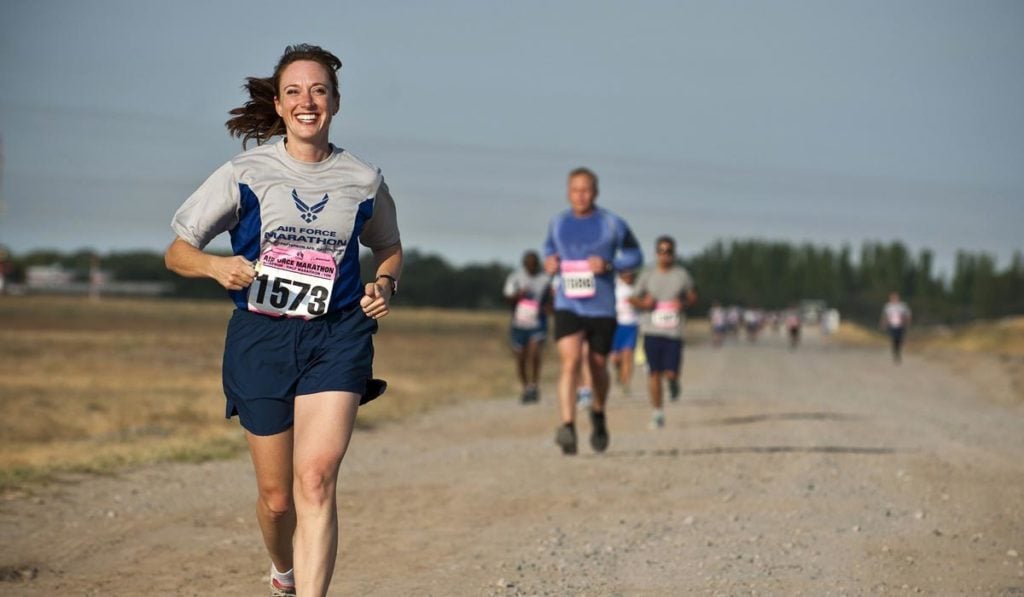 smiling woman runs a race