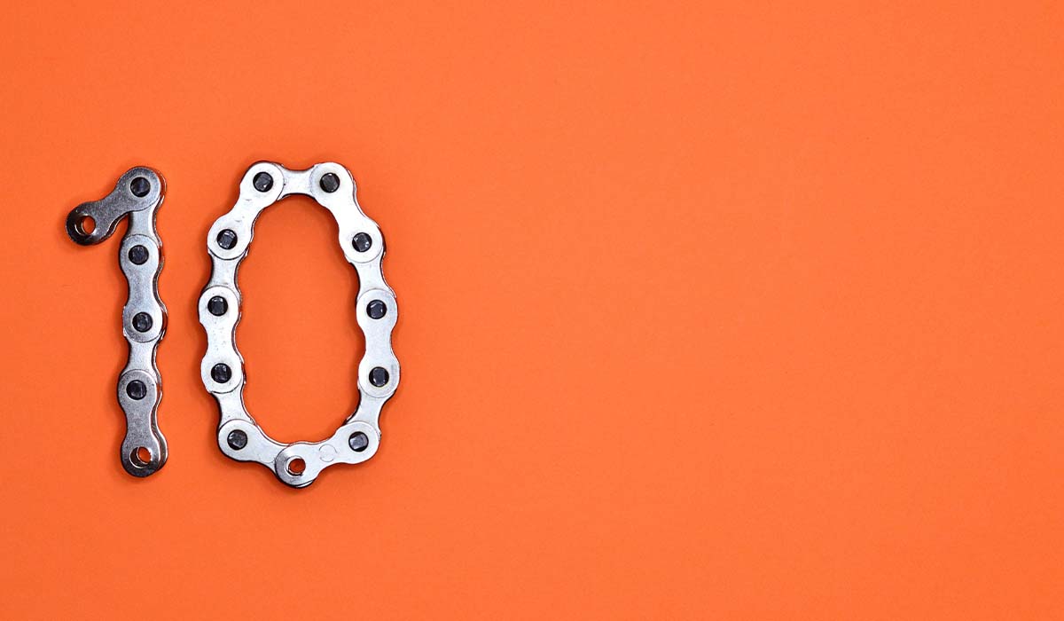 The number 10 in chains against an orange background