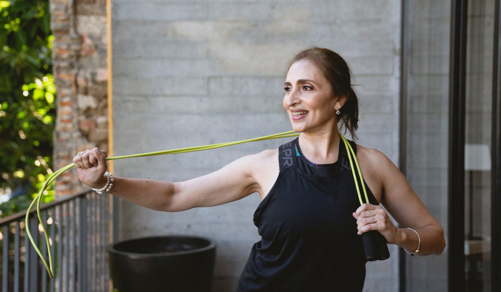 woman stretching on her porch