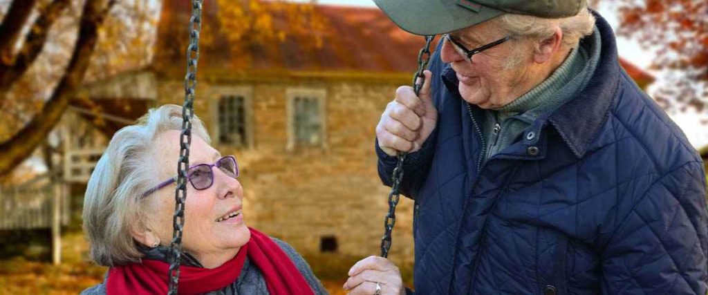 elderly couple looking loving at each other