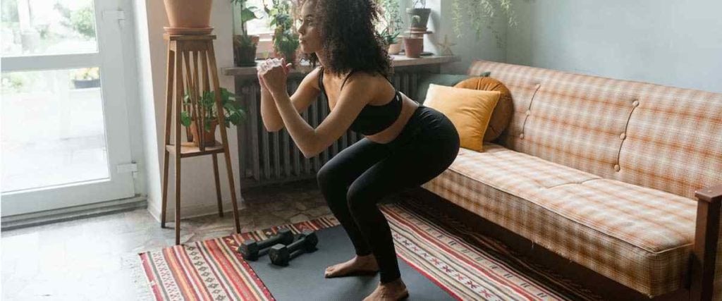 Woman Doing a Squat in her Home
