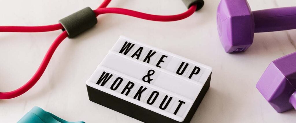 Sign with 'wake up & workout'