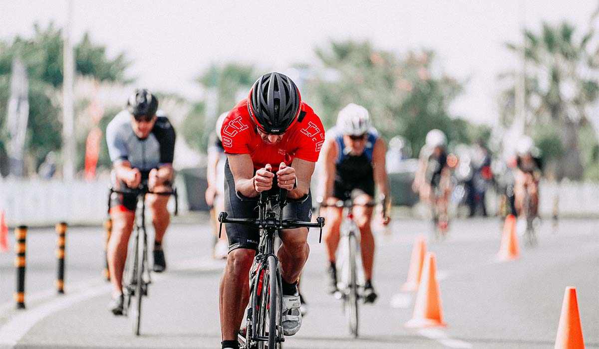 3 Male Cyclists Racing