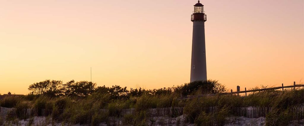 Lighthouse and sunset on Cape May Shoreline Ride.