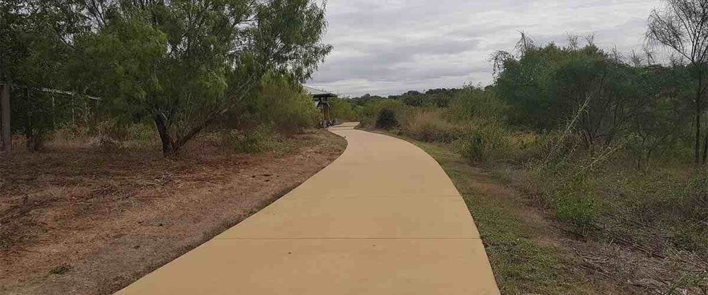 View of the paved path at The Greenline in San Antonio Texas.