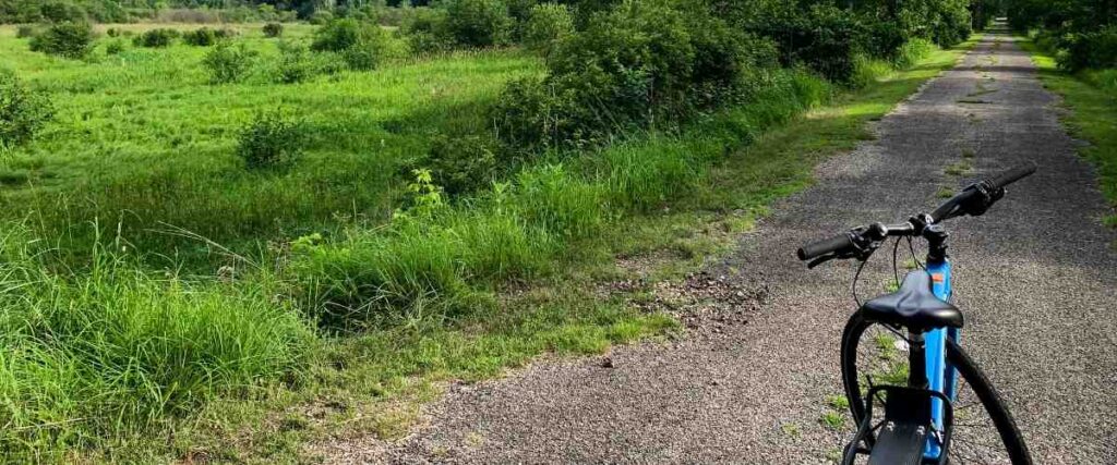 Mountain bike on its stand on a bike path.
