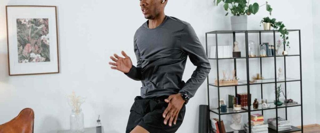 Man running in place in his living room.