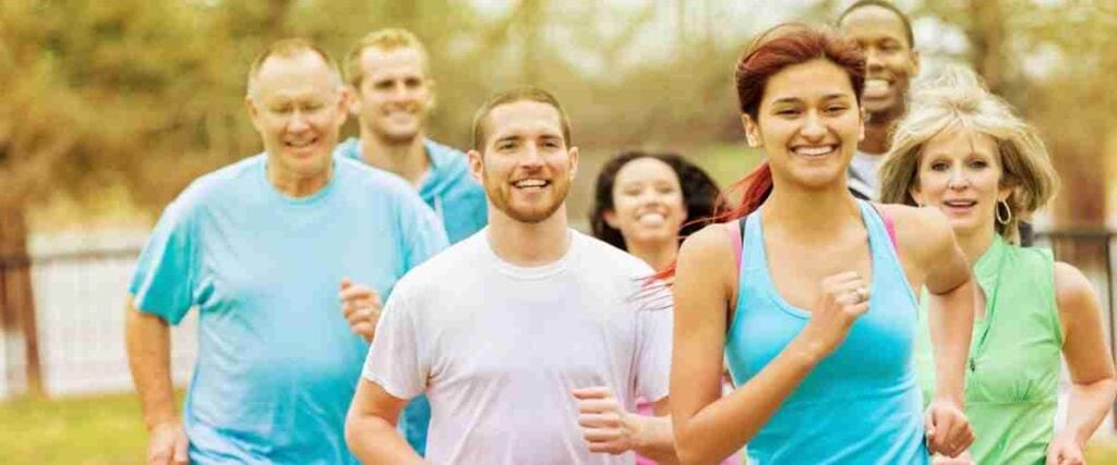 Group of men and women in a running group at a park. 