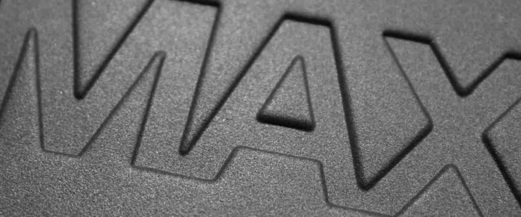 Close up of the word 'max' on a dumbell. 
