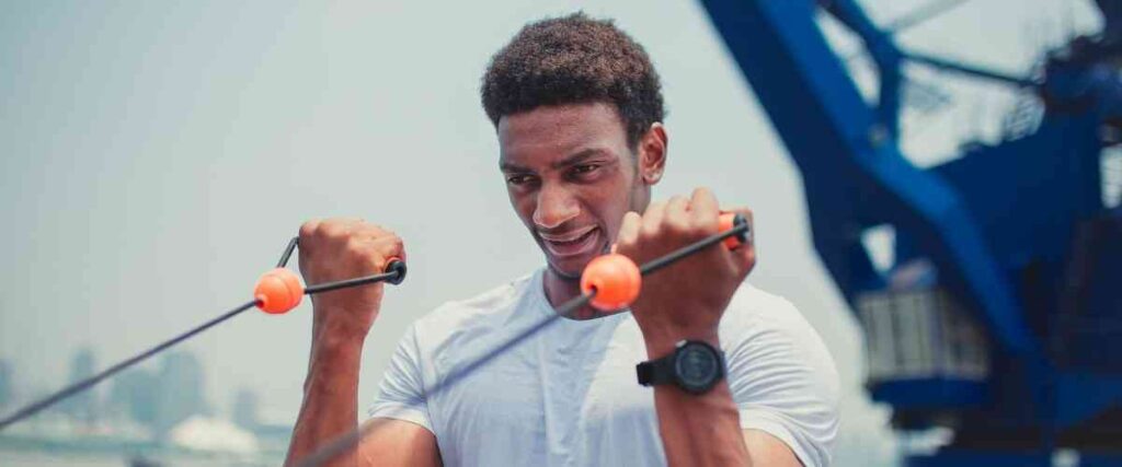 Man using weights as part of cross-training.