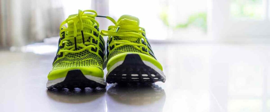 Close-up of neon green running shoes.