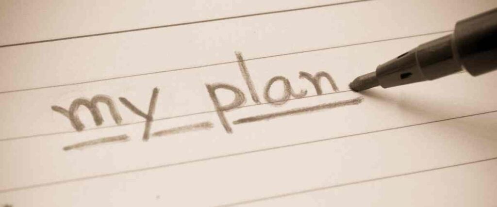 'My plan' written on a notepad with view of the marker.