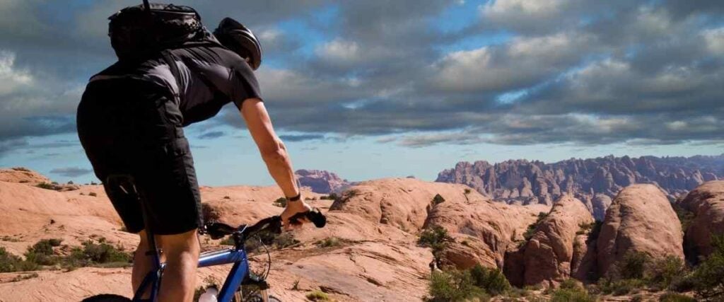 Mountain biker overlooking canyon.