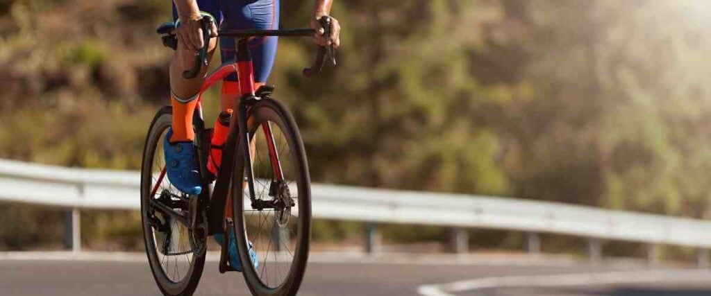 Cyclists going up steep road.