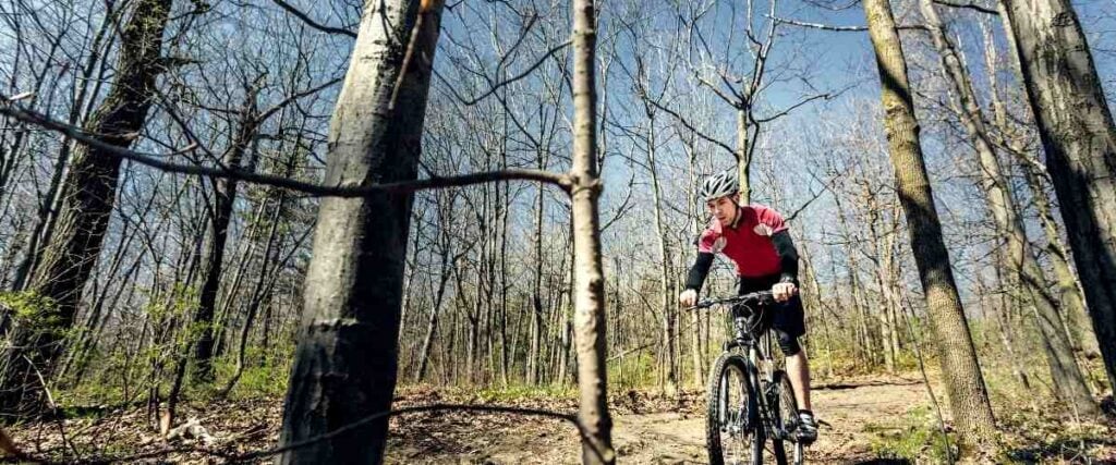 Mountain biker going down big hill.