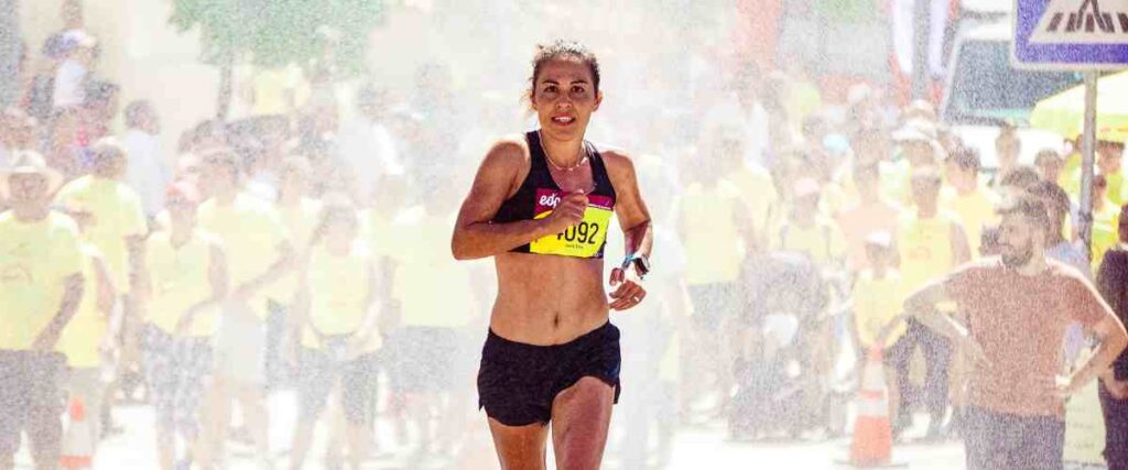 A female runner finishing a race. 