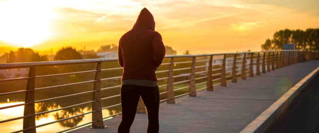 A runner crossing a bridge.