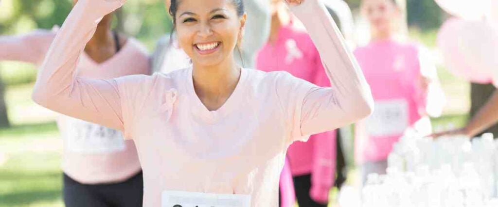 Woman getting ready to run for breast cancer awareness. 