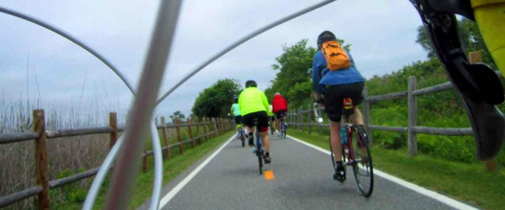View of a cyclists of riding a bike on bike path. 