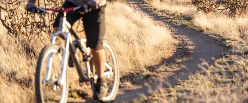 Close-up of a cyclists on single track on the White Trail trail system. 