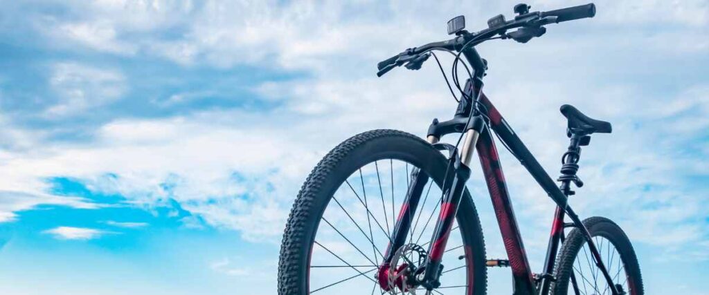 View of a bike from the front with a big clear blue sky as the background. 