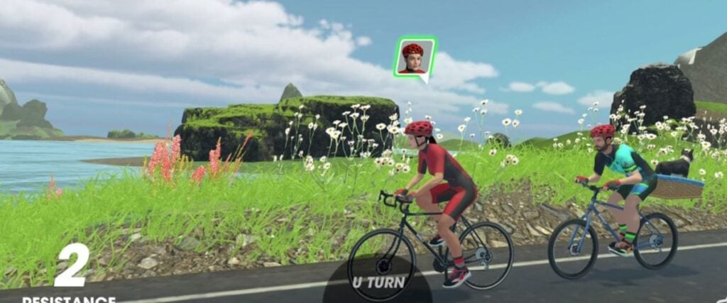 Two avatars in Vingo cycling down a hill.