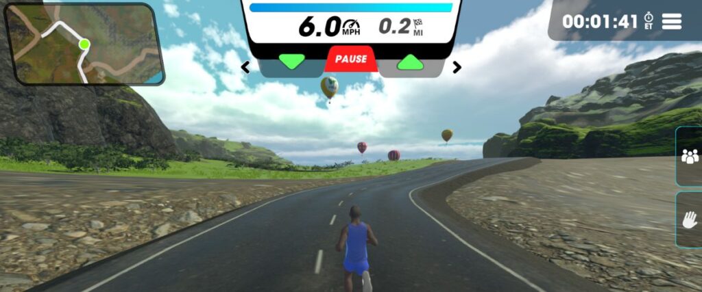 A male avatar running thru Lake Front Junction route in Vingo with hot air balloons in the distance. 