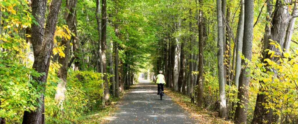 A cyclists on the Mon River Trail in West Virginia. 