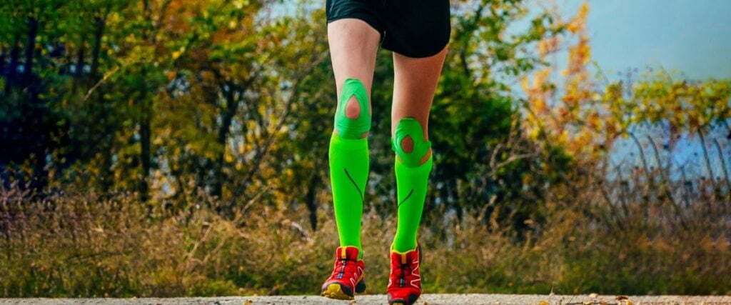 A female runner wearing compression socks.