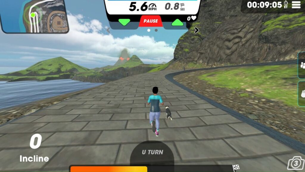 View of running avatar on Borealis Path in Vingo running next to a lake with a volcano ahead. 