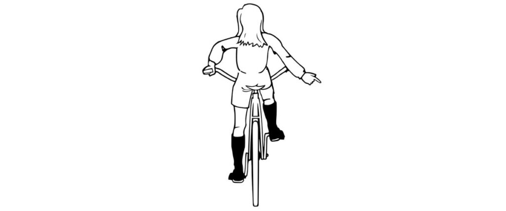 A female graphic cyclists doing road debris signal.
