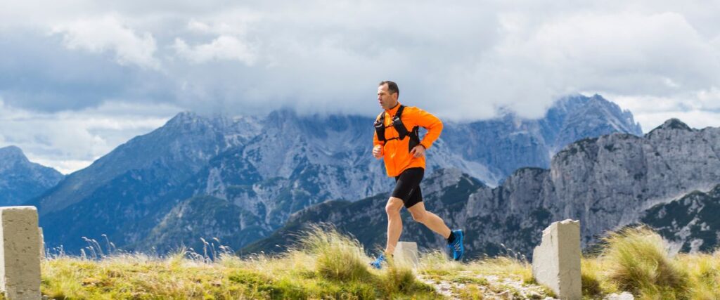 A male runner on the mountains with a change in altitude. 